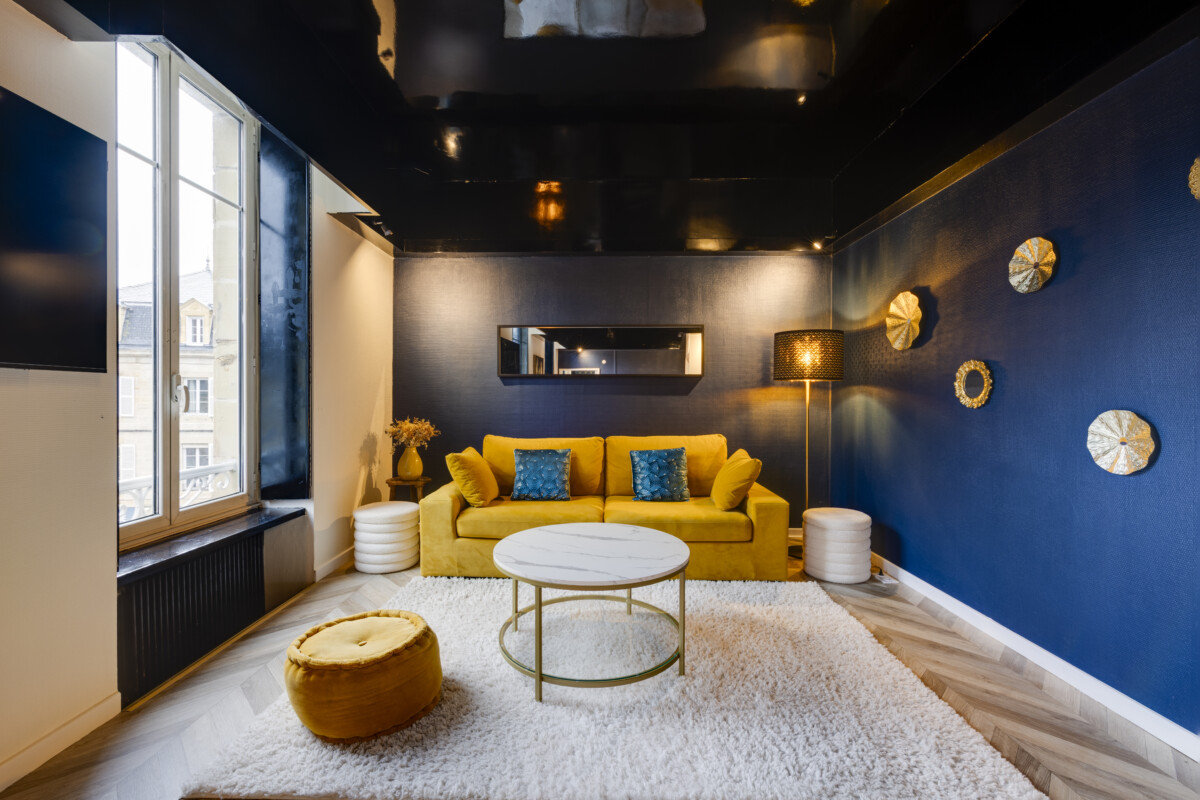 Grand salon lumineux Appart’Cosy Brive, appartement moderne hyper-centre